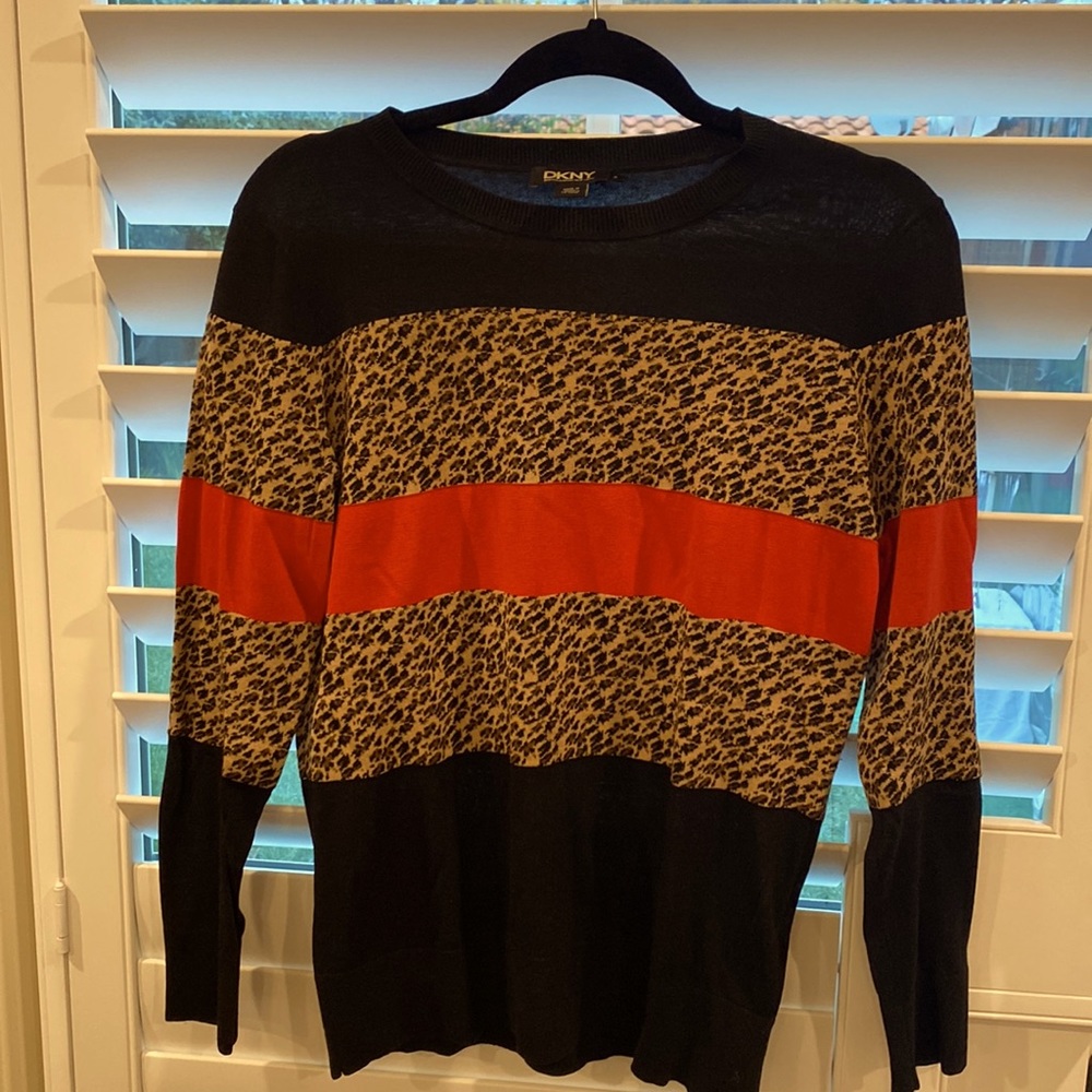 Very chic and current DKNY silk/cashmere sweater. Must have in your closet.